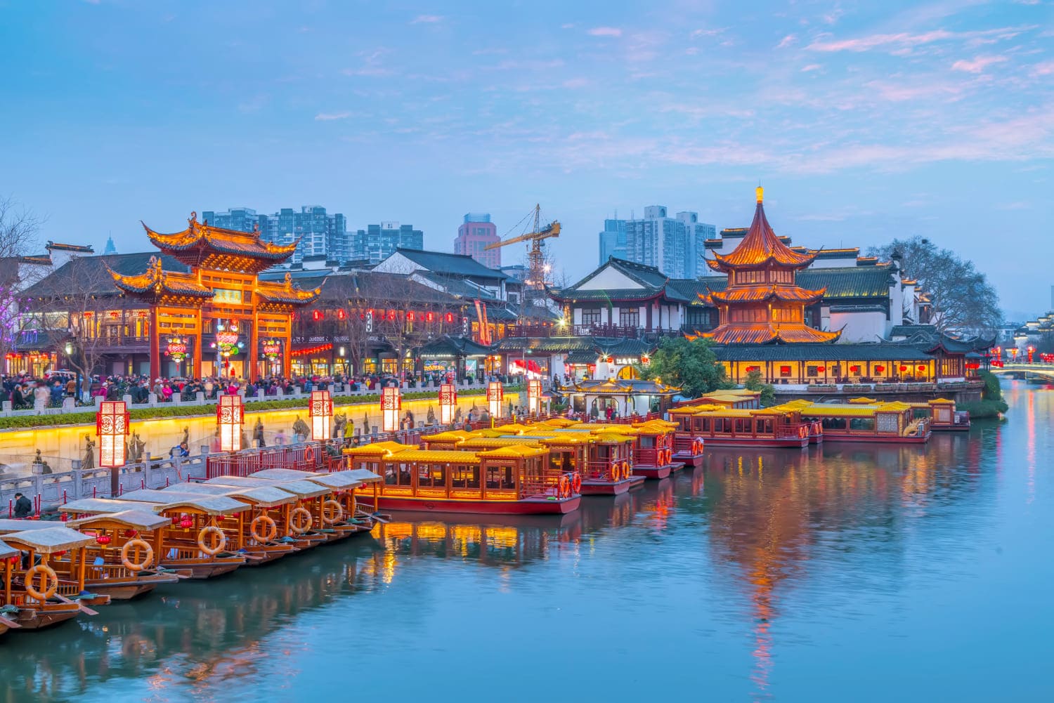 Ancient building in China with light on at evening
