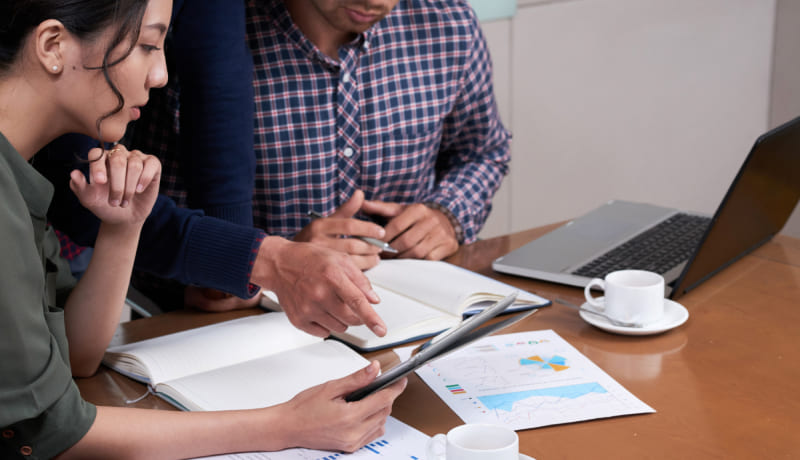 business people discussing charts and diagrams in the office